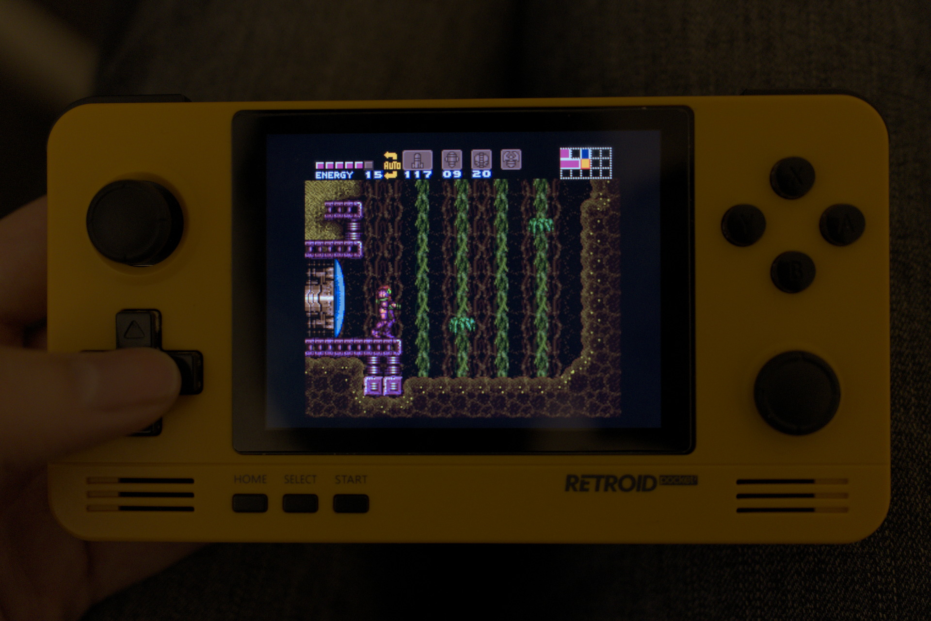 Super Metroid: Samus is in upper Maridia, with sand, vines and water.